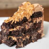 German Chocolate (1 Sl) · Delicious chocolate cake with traditional caramel coconut topping and pecans.