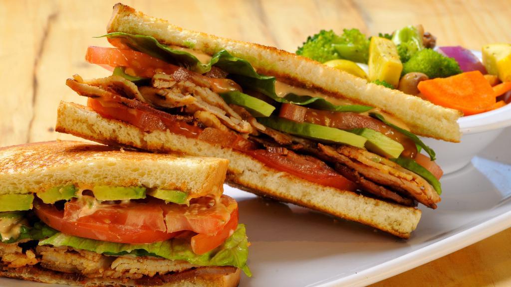 Balt Sandwich · Applewood bacon, avocado, lettuce, and tomatoes with aioli on toasted white bread.