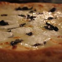 Tartufo Pizza · Black truffles, whipped ricotta, fresh mozzarella, truffle oil.