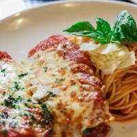 Chicken Parmesan · Lightly breaded, homemade tomato sauce, mozzarella with pasta.