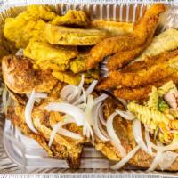 Fish (Pwason) · Fried or grilled fish, rice, fried plantain, and salad.