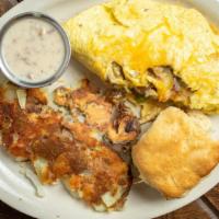 Cracker Omelette · Sausage, bacon, onions, bell peppers, Jack and cheddar cheese folded into a fresh egg omelet...