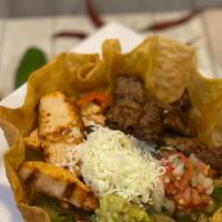 Taco Salad Fajita · Large crispy flour tortilla shell with your choice of grilled steak or grilled chicken, bell...