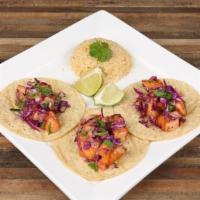 Grilled Salmon Tacos · Three grilled or fried salmon tacos topped with pico de gallo, red cabbage and spicy mango h...