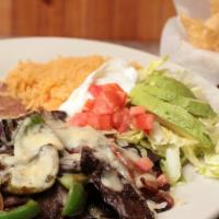 Mexican Alambre · Bacon, bell pepper, onions, tomatoes and your choice of steak or grilled chicken cooked toge...