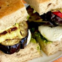 Roasted Eggplant Focaccia Sandwich · Roasted eggplant , Zucchini, red pepper, pesto, sun dried tomato, calabrese chili, and fresh...