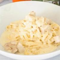 Fettuccine Alfredo Style · Chicken breast and parmesan cream sauce.