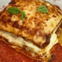 Lasagna · Beef Bolognese, bechamel, aged parmesan cheese, basil, pomodoro sauce