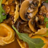 The Golden Plate · Truffle & Ricotta Tortelloni, Golden Sauce ( mixed mushrooms, truffle and creamy demi glace)