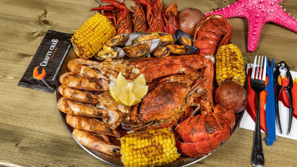 Seafood Platter (Small) · Snow Crab, Whole Shrimp, Crawfish, Mussels, Clams, Corn, and Potatoes, (not sold by the pound, cannot be substituted).