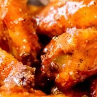 Hot Wings · 8 Jumbo Wings tossed Most Delicious Hot Wing Sauce