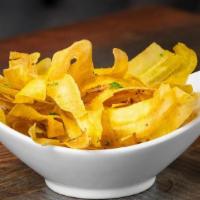 Mariquitas · Plantain Chips served with our homemade mojo