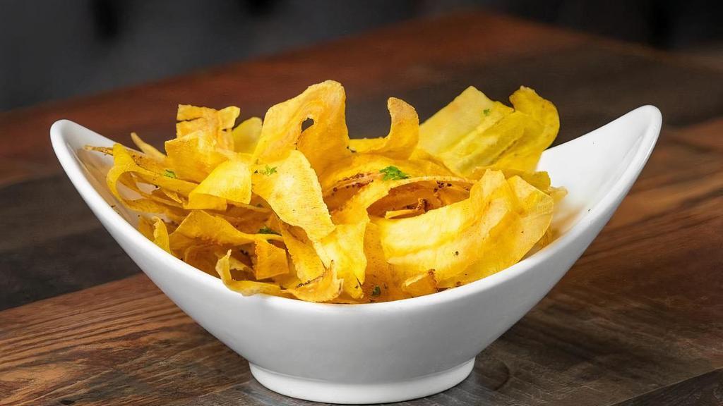 Mariquitas · Plantain Chips served with our homemade mojo