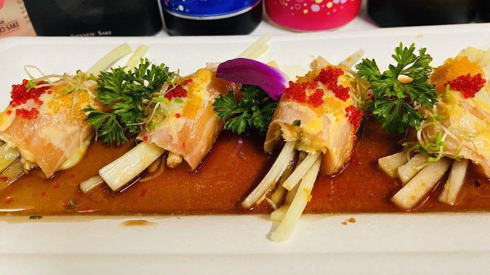 Salmon Bonsai · Spicy blue crab and cucumber wrapped in sliced salmon, served with spicy ponzu, special sauce and fish egg.