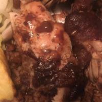 Jerk Chicken · Served with your choice of rice and one side item...plantains included