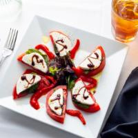 Caprese Salad · Fresh Roma tomato, mozzarella and basil, drizzled with balsamic glaze and extra virgin olive...