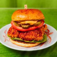 Spicy Fried Chicken Sandwich · Spicy crispy chicken breast with tomato, lettuce, onion, pickles, and house sauce.