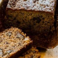Banana Bread Slice · Moist and delicious, classic banana nut loaf, filled with crunchy walnuts and sweet overripe...