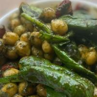 Chickpea Salad Pint · Chickpeas tossed with spinach, red peppers, and basil pesto. sold by the pint.