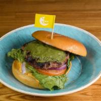 Tribos Beef Burger · 1/4 pound beef with our signature green sauce, cheese, lettuce, onion and tomato.