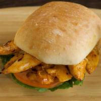Grilled Chicken Sandwich · Grilled chicken with onions, lettuce, pickles and tomato on a toasted bun and grilled with y...
