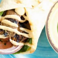 Tribos Lamb Pita · Chunks of Flame-grilled lamb chops on pita bread with our special sauce, lettuce and tomato.