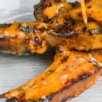 Lamb Chops 2 Pieces · 2 lamb chops marinated in our special marinade, flame grilled with your choice Peri Sauce.