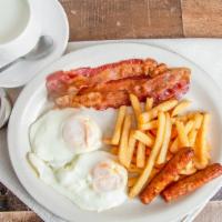 Los Hornos Complete Breakfast · Coffee with milk, toast, eggs, sausage, bacon, and french fries.