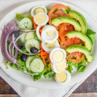 Spring Salad · Boiled eggs, lettuce, tomatoes, cucumber, avocado, carrots, onions, and olives.

Platos marc...