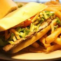 Pan Con Bistec · Steak with onions, potato sticks, lettuce, and tomatoes on a cuban bread. Comes with french ...