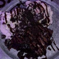 Slutty Brownie · Cookies n cream ice cream over an Oreo stuffed brownie topped with chocolate fudge, whipped ...
