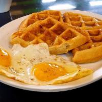Waffles With Eggs · Our Waffle are big, fluffy and Golden. Served with 2 Eggs of your Choice.