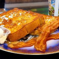 French Toast With Bacon · Sourdough bread dipped in a rich egg batter, served golden brown, lightly dusted with powder...