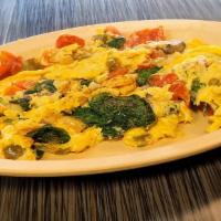 Go Greek Omelet · Feta cheese, spinach and tomato. Served with Home Fries.