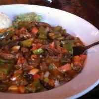 Puntas A La Mexicana · Beef tips cooked with nopal, tomato, and onions in a spicy chile de arbor salsa, served with...