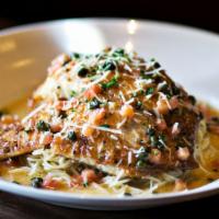 Fresh Catch Hemingway · Fresh catch pan-seared in lemon butter and white wine, lemon, tomatoes, capers, served over ...
