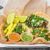Soft Tacos · Homemade corn tortilla topped with onion, cilantro and your choice of steak, chicken, marina...