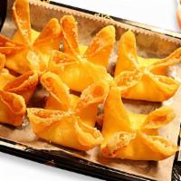 Crab Rangon · Hand folded deep-fried wontons filled with a mixture of crab meat and cream cheese.
