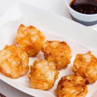 Shrimp Shumai (6Pcs) · Chinese dim-sum style dumplings filled with shrimp, and served with delicious sauce.