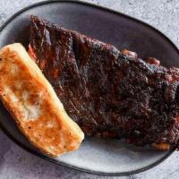 Half Slab Of Ribs · A half slab of our competition-quality St. Louis–cut ribs, served with Texas toast