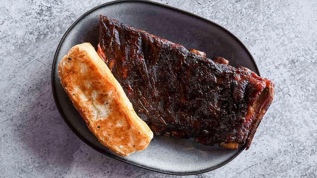Half Slab Of Ribs · A half slab of our competition-quality St. Louis–cut ribs, served with Texas toast