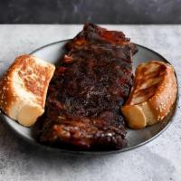Full Slab Of Ribs · A real labor of love: St. Louis–cut, hand-rubbed, painted with our own barbeque sauce, and s...