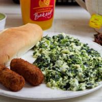 Popeye El Marino · Four scrambled egg whites with spinach and ricotta cheese, two cheese croquettes, a bread ro...