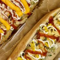 Classic Hot Dog · Beef sausage, cabbage, corn, onion, Gouda cheese, potato sticks, sauce of your choice: mayon...