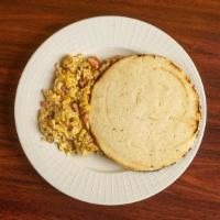 Pericos Con Arepa · Scrambled eggs with onion, tomatoes, and arepa.