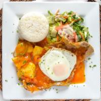 Bistec A Caballo · Steak in our creole sauce with egg on top, served with rice, cassava, potatoes, and salad.