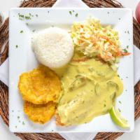 Filete De Tilapia · Fried or grilled tilapia filet, served with rice, salad, and our delicious green plantains.