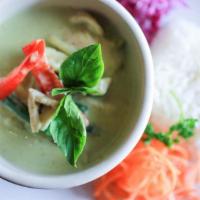 Green Curry · Zesty green chili coconut curry with sliced bamboo, pepper, green beans and garden fresh bas...