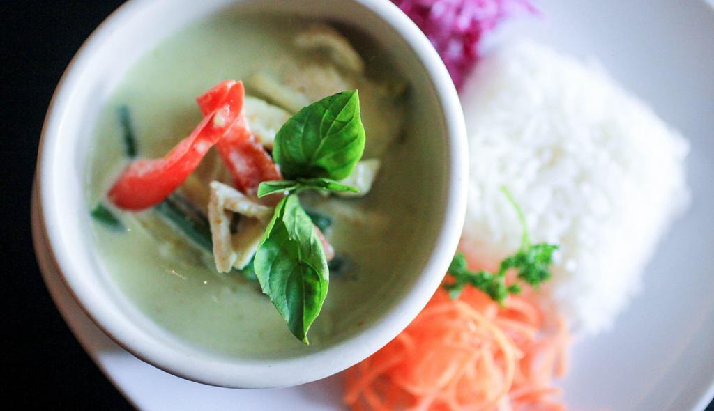Green Curry · Zesty green chili coconut curry with sliced bamboo, pepper, green beans and garden fresh basil.
