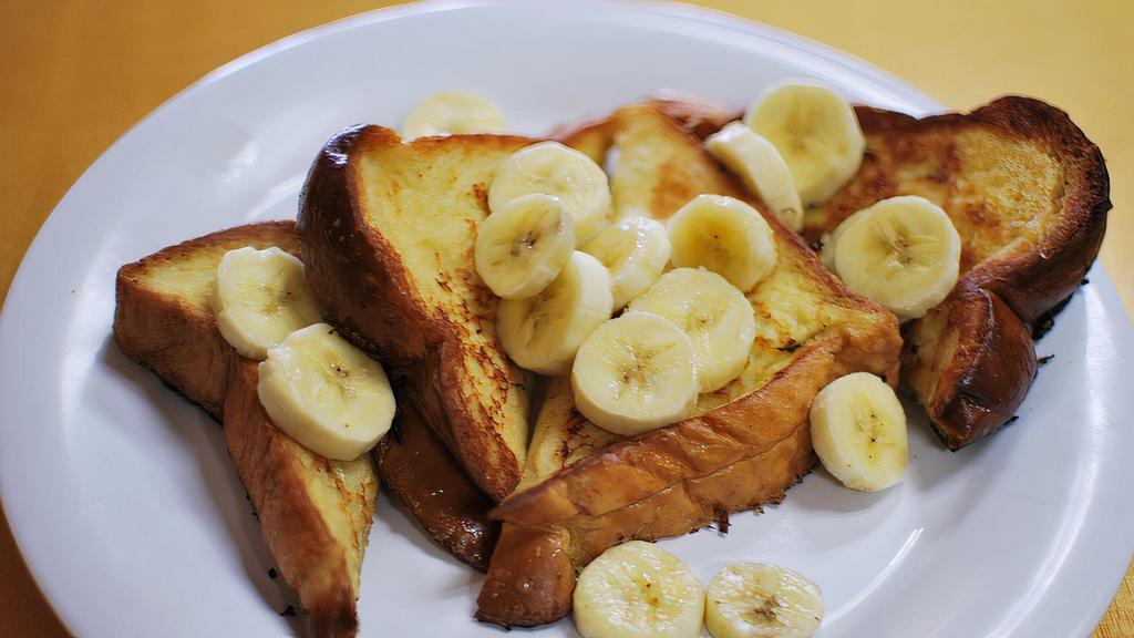 French Toast · Dipped in our homemade batter grilled to golden brown perfection and topped with whipped cream